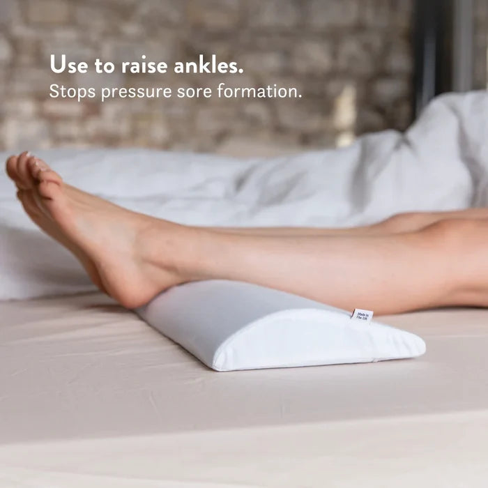 Bed Back Support Pillow - Putnams Place this D shaped firm pillow under the small of your back to support the natural S shape of the spine during sleep. Gives pressure relief to the back when in pain.