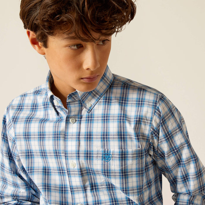 Boy's Ariat long sleeve Pro Series shirt in Blue Plaid. Front view showing button down collar and Ariat shield logo stitched on left chest.