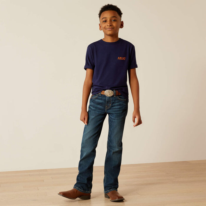 Boy's Ariat short sleeve tee in Classic Blue. Full front view showing shirt tucked.