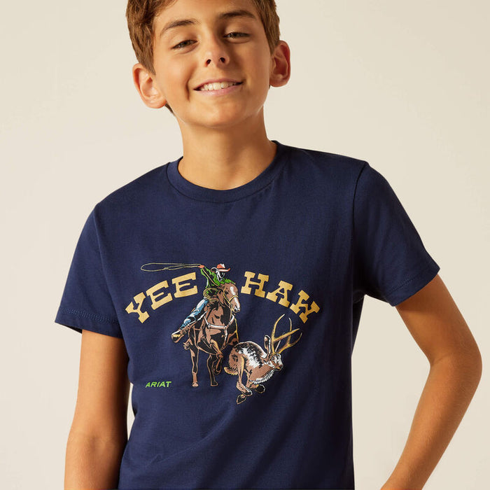 Boy's Ariat short sleeve t-shirt in Dark Navy with a "Yee Haw" Graphic print on front showing a cowboy roping a jackalope. Close up view of front graphic print.