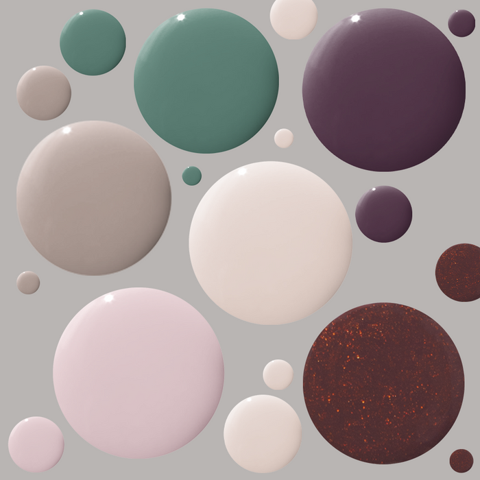 Various glossy fall-inspired gel polish shades displayed in droplets from the Fall Gel Polish Set by Olive and June