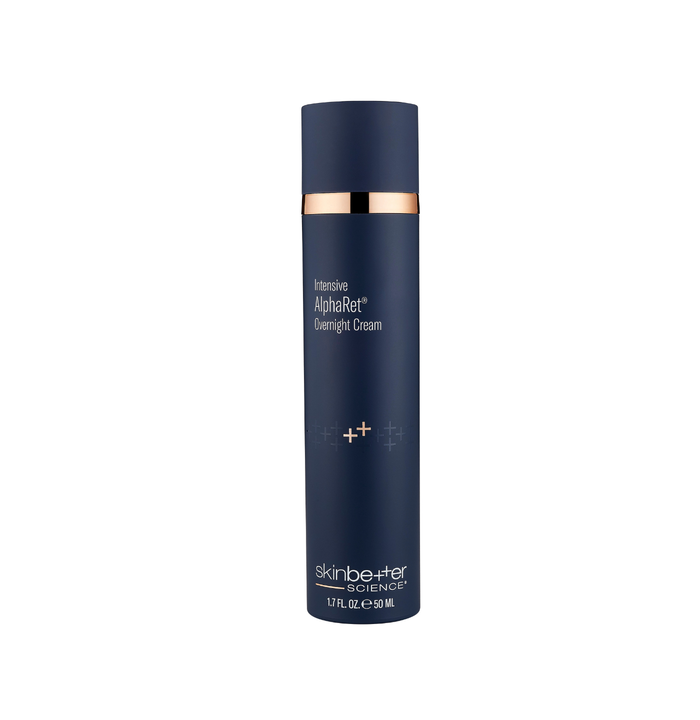 Blue skincare bottle with rose gold accents on a white background