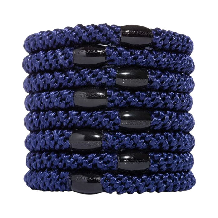 Set of blue hair ties with black ends on a white background