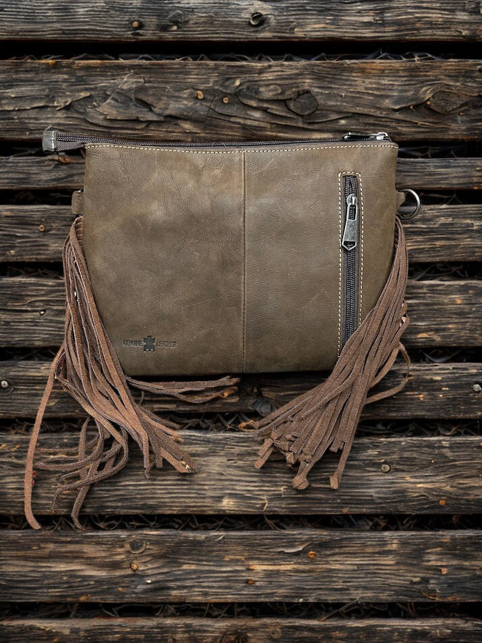 This Brown tooled leather and cowhide purse features a removable adjustable shoulder strap and a zippered closed concealed carry pocket on the rear. Inside it has six card slots and a zippered closed pocket. Rear View