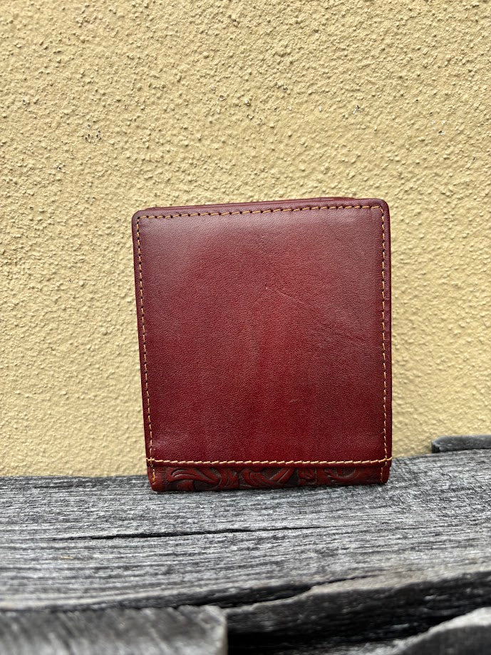 A brown bifold wallet featuring a embossed buck design with brown inlay. Rear view