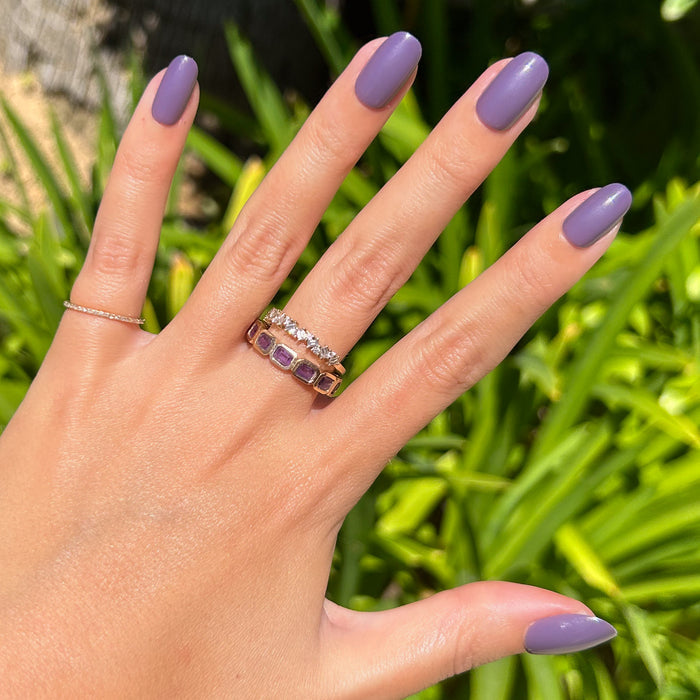 Art Class - Press-On | Short | Round showing hand with muted purple short round press-on manicure outdoors in sunlight