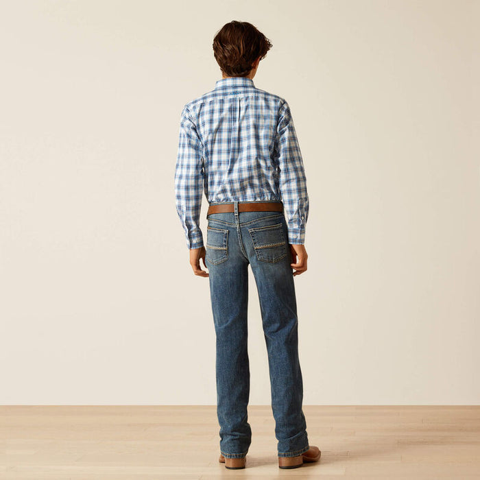 Boy's Ariat relaxed fit boot cut jeans in a medium wash. Rear view