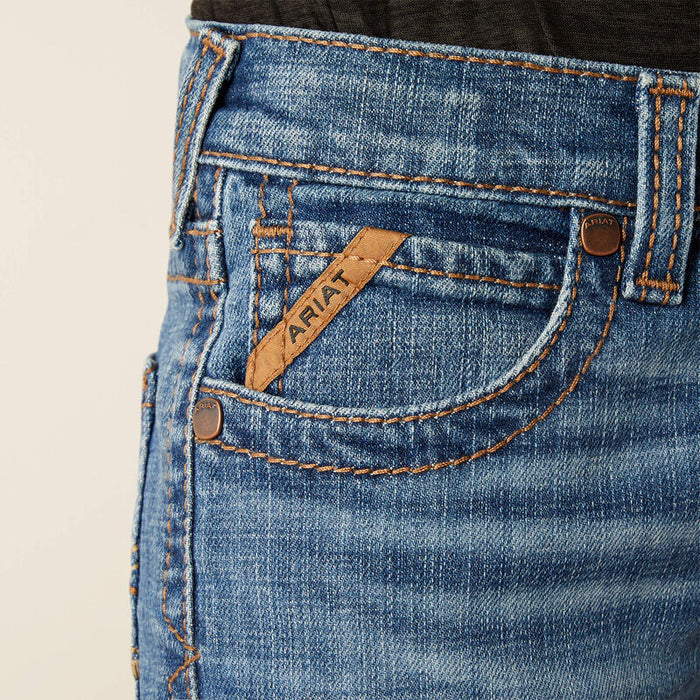 Boy's Ariat B5 slim straight jean. Close up of front pocket showing Ariat logo tag on front pockets.
