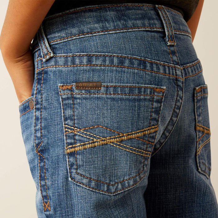 Boy's Ariat B5 slim straight jean. Close up of stitching on back pockets.