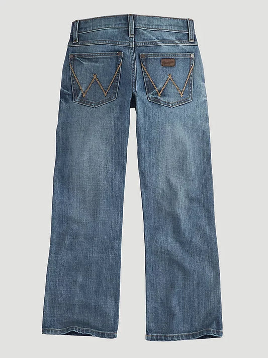 Back view of Wrangler 20X Greeley Vintage Bootcut Slim Fit Jeans for boys, showing the back pockets with the brand's logo.