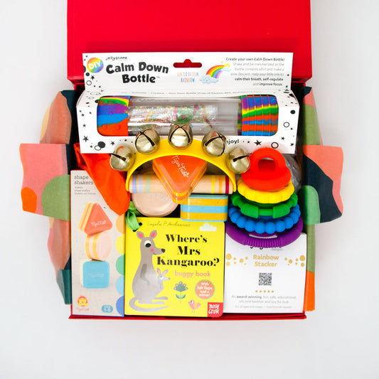 Signature red box including: Peek-a-boo Board Book - Felt Flaps&nbsp;
Jellystone Calm Down Bottle - Rainbow
Jellystone Silcone Stack Toy - Rainbow
Calm &amp; Breezy Handbell - Wooden with Brass Bells
Tiger Tribe Shape Shakers Set of 3 - Made from recycled eco plastic

Price: 120