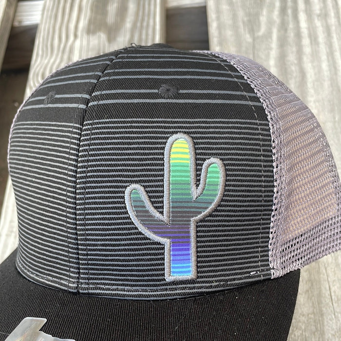 Black trucker cap with Grey stripes, Grey mesh back, a solid black bill and a Serape Cactus Patch. Close up view of patch.