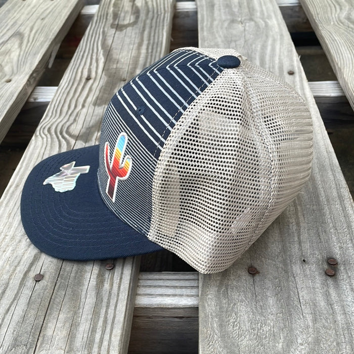 Navy and Grey trucker cap with a striped pattern featuring a cactus patch design on the front, solid Navy bill, Grey mesh back. Side view