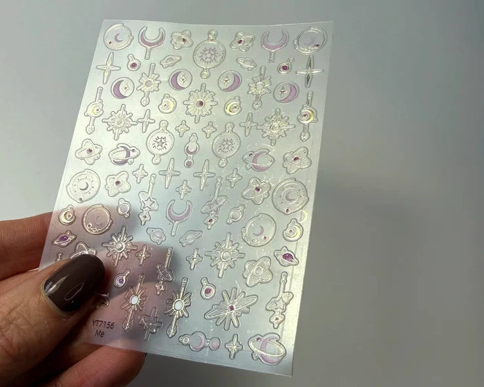 Celestial nail art decals, angled close-up