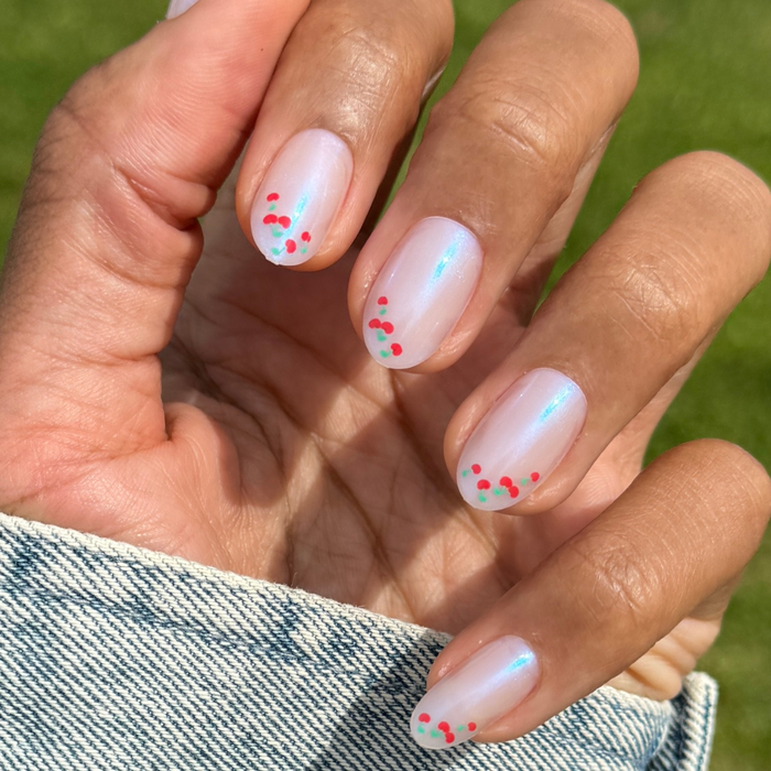 Cherry French - Press-On | Medium | Oval nails with iridescent sheen and small red cherry accents for easy at-home mani