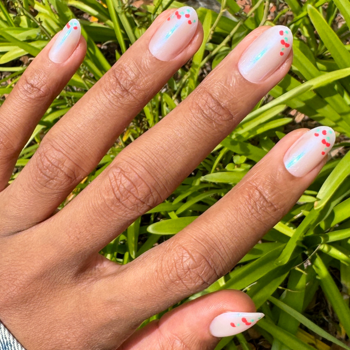 Cherry French - Press-On | Medium | Oval nails with chrome French tips and cherry accents for easy at-home mani