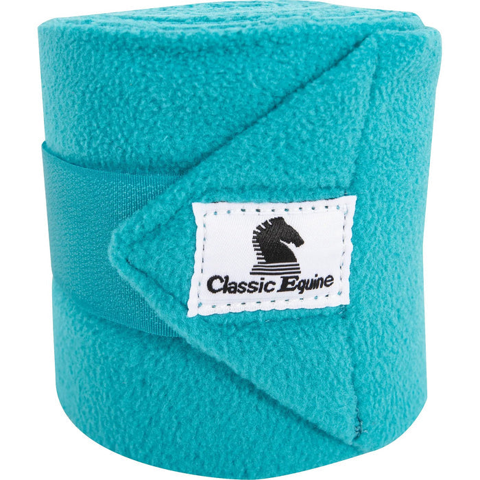 Classic Equine Classic Polo Wrap shown rolled up and closed by its velcro strap and displaying the Classic Equine cloth logo label. Shown in turquoise.