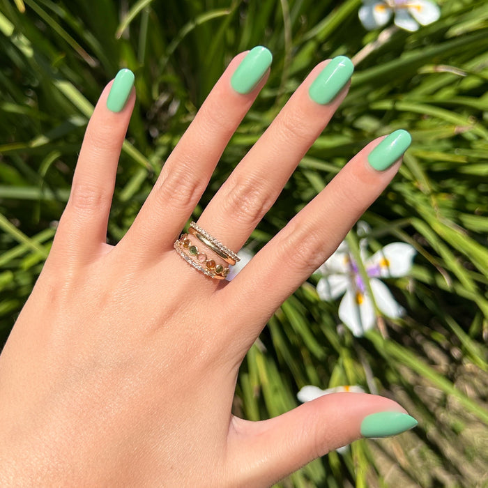 Cucumber Sandwich - Press-On | Short | Round showing hand with minty green short round false nails against leafy background