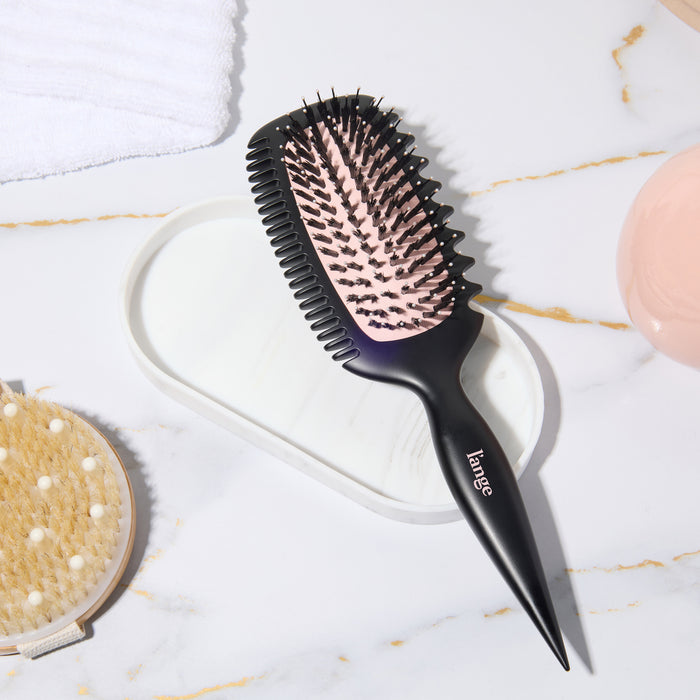 Curl Sculptor brush on a vanity tray