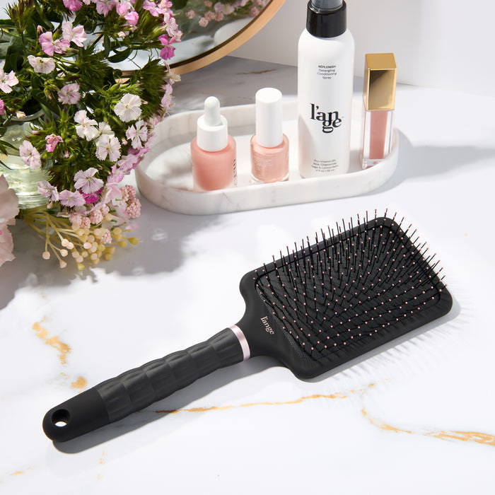 L’ange detangling paddle nylon brush on a vanity