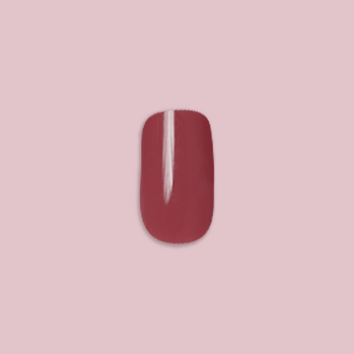 Fig Ranch - Press-On | Short | Squoval showing single short squoval cool-toned fig pink press-on false nail on soft pink background