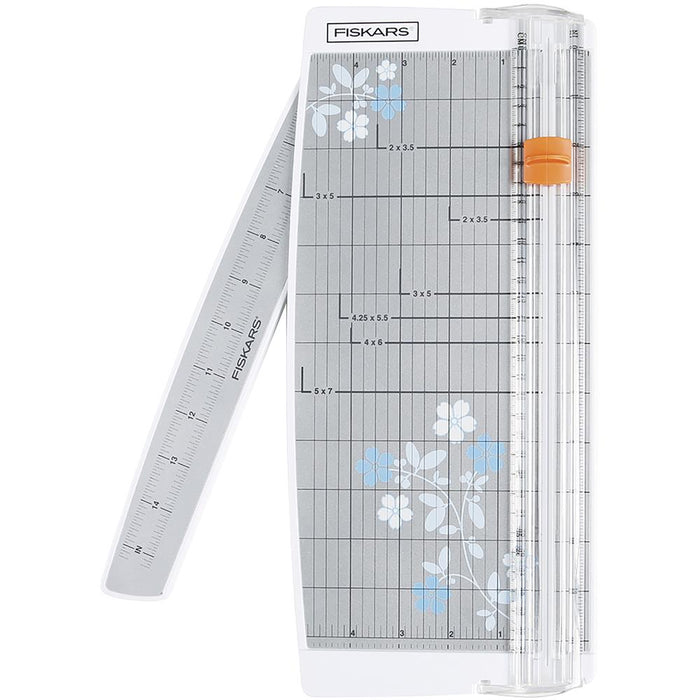 FISKARS-Euro Paper Trimmer. This trimmer features the triple track blade and rail system, a swing-out arm that extends the measuring deck to 15 inches, an ergonomic carriage for a better grip while cutting, and rubberized feet for stability. Available at Embellish Away located in Bowmanville Ontario Canada.