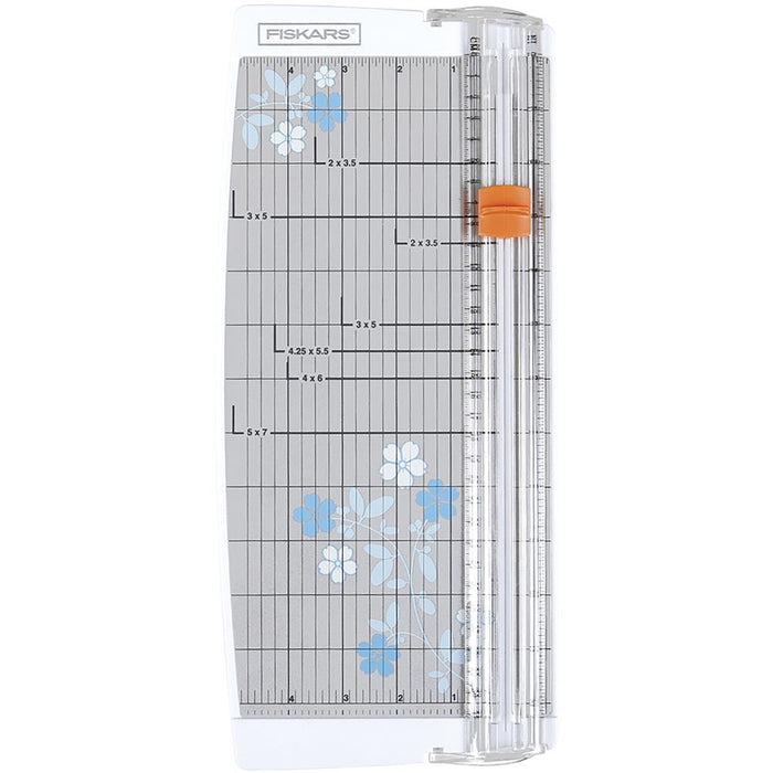 FISKARS-Euro Paper Trimmer. This trimmer features the triple track blade and rail system, a swing-out arm that extends the measuring deck to 15 inches, an ergonomic carriage for a better grip while cutting, and rubberized feet for stability. Available at Embellish Away located in Bowmanville Ontario Canada.