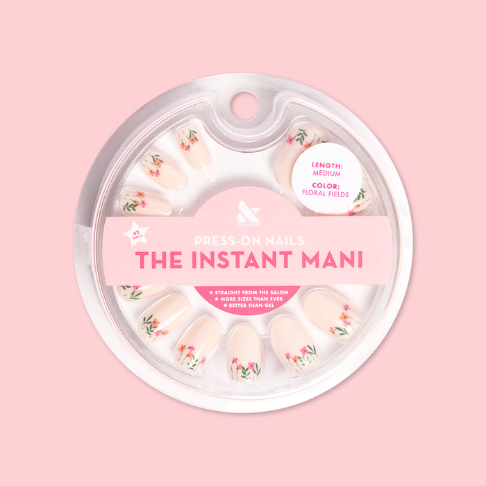Floral Fields - Press-On | Medium | Oval showing medium oval press-on nails with red poppy floral designs in circular packaging