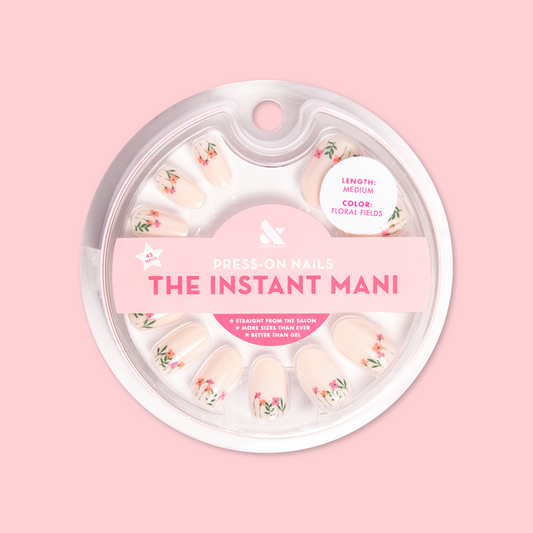 Floral Fields - Press-On | Medium | Oval showing medium oval press-on nails with red poppy floral designs in circular packaging
