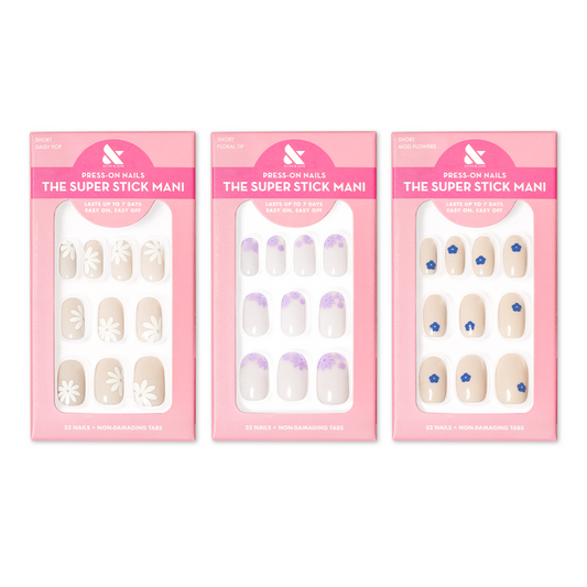 Floral Trio showing three sets of beige and white press-on nails with daisy and blue flower designs for easy at-home mani