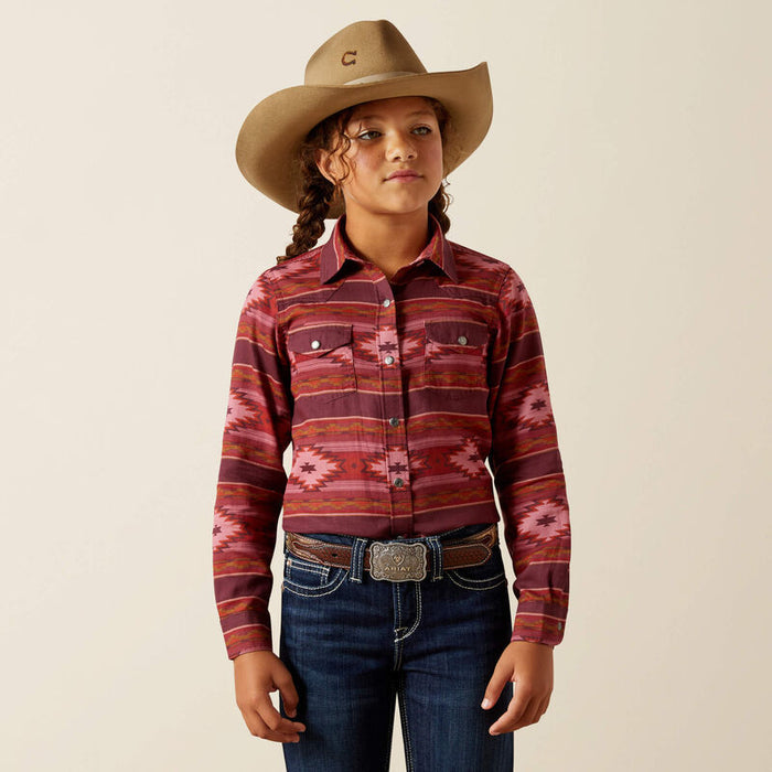 Girl's Ariat long sleeve shirt in Rosa Southwestern, shirt has pearl snaps and a Southwestern style pattern in burgundy and red tones.