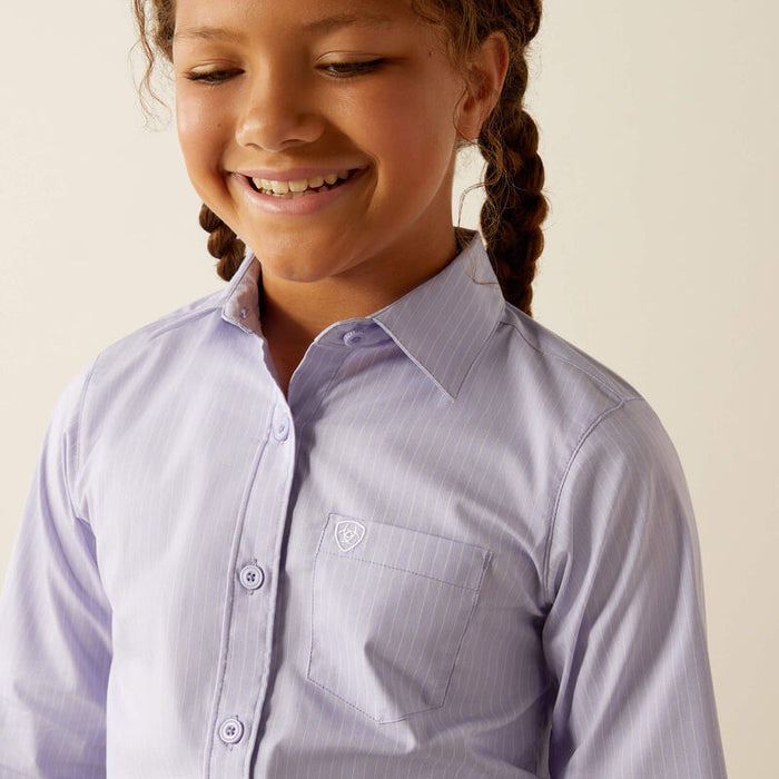 Girls Ariat Long Sleeve shirt in Sweet Lavender Stripe. Close up of chest pocket showing Ariat shield logo.