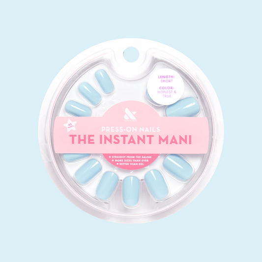 Honest & True - Press-On | Short | Squoval showing serene blue short squoval press-on nails in round clear packaging