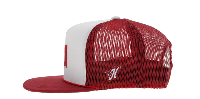 Red and white snapback cap with Oklahoma state outline and OU logo patch. Side view stock photo showing H patch.