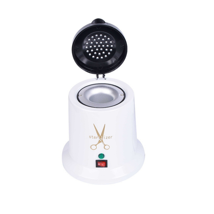 Q002G Hot Bead Salon Tools Sterilizer | A white and black electric hot bead sterilizer machine with its lid open, featuring gold scissors graphic and a red power switch on the front, set against a plain white background.