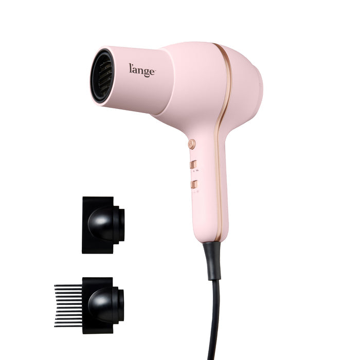 L'ange Hot Stuff hair dryer in blush, shown with concentrator and comb attachments on a blank background