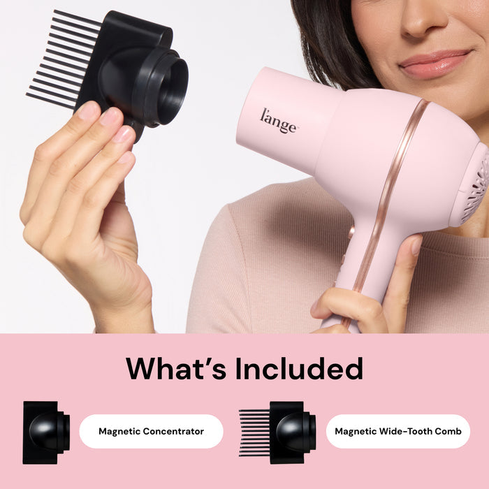 Woman holding L'ange Hot Stuff blush hair dryer and wide-tooth comb attachment. "What's Included – Magnetic Concentrator, Magnetic Wide-Tooth Comb"
