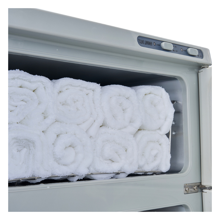 E062 Double Hot Towel Cabinet | A close-up of a white towel warmer, showing several white rolled towels inside on a metal rack.