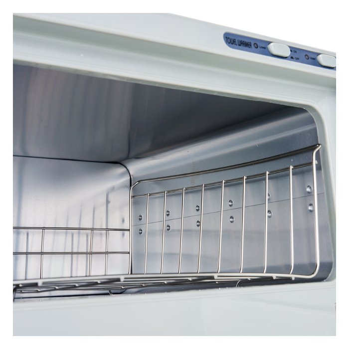 E062 Double Hot Towel Cabinet | Close-up of the interior of a white Hot Towel Cabinet, showing a stainless- steel inside with metal rack and a control panel at the top.