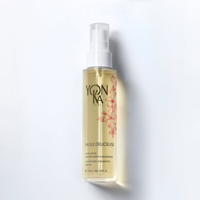 Huile Delicieuse bottle with tiare and jasmine flowers fast-absorbing botanical body and hair oil