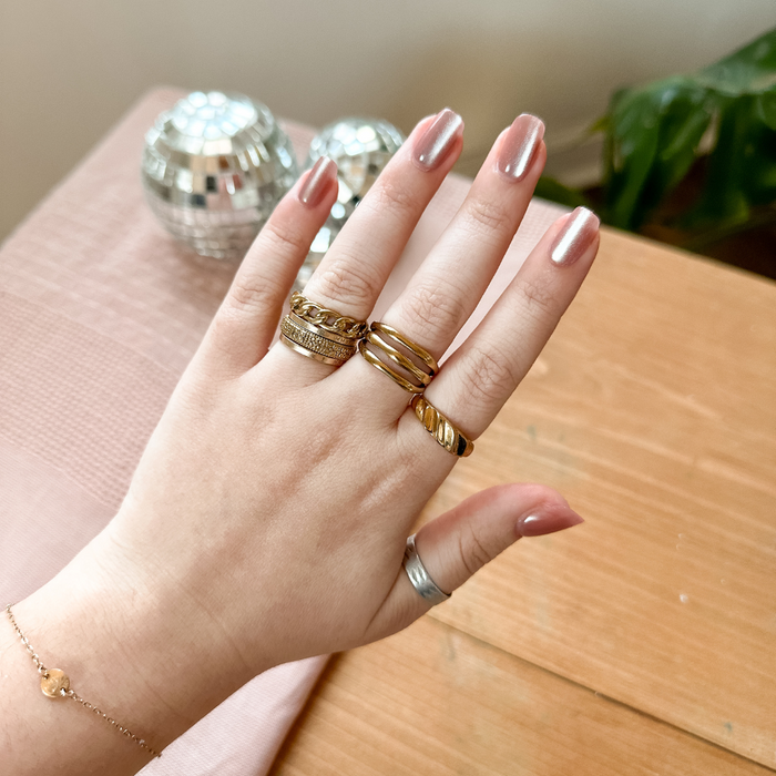 HZ Velvet - Press-On | Short | Squoval with soft dusty rose velvet effect nails on hand adorned with gold rings for at-home mani