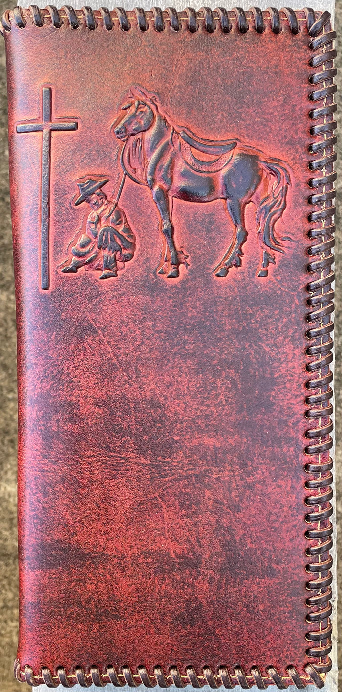 Brown leather tall wallet with whipstitch border and a embossed Praying Cowboy design. Front View