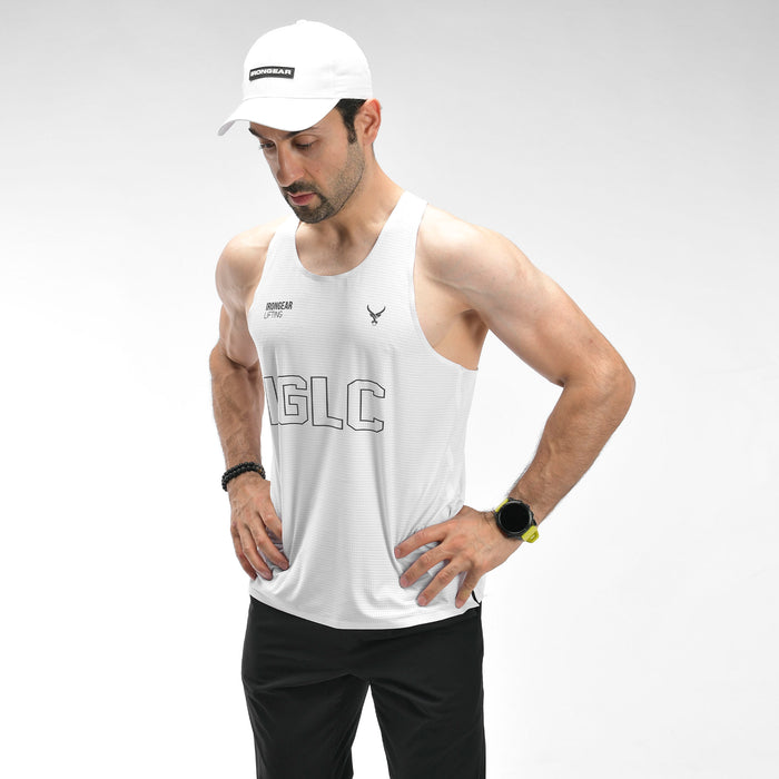 Man wearing a white tank top with 'MAGIC' branding on a gray background