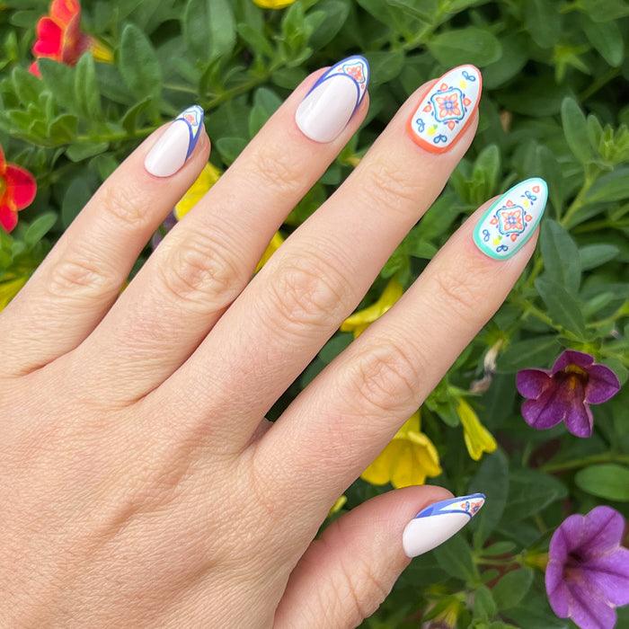 Italian Tile French - Press-On | Medium | Almond featuring intricate blue and orange tile-inspired tips and accent nails for at home mani