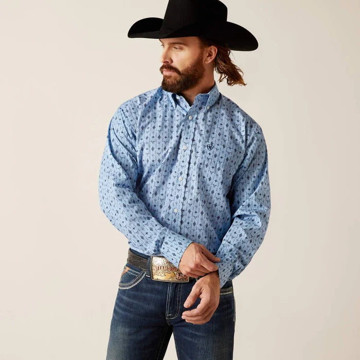 Men's Ariat Light Blue long sleeve shirt with a western print of steer head and geometric shapes. Front view showing shirt tucked in.
