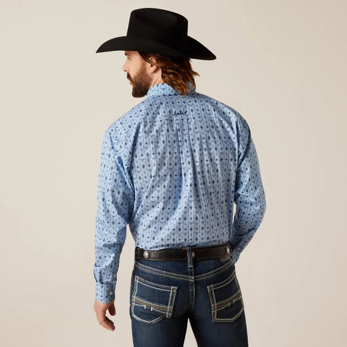 Men's Ariat Light Blue long sleeve shirt with a western print of steer head and geometric shapes.  Rear view showing shirt tucked in and blocked Ariat logo on yoke.