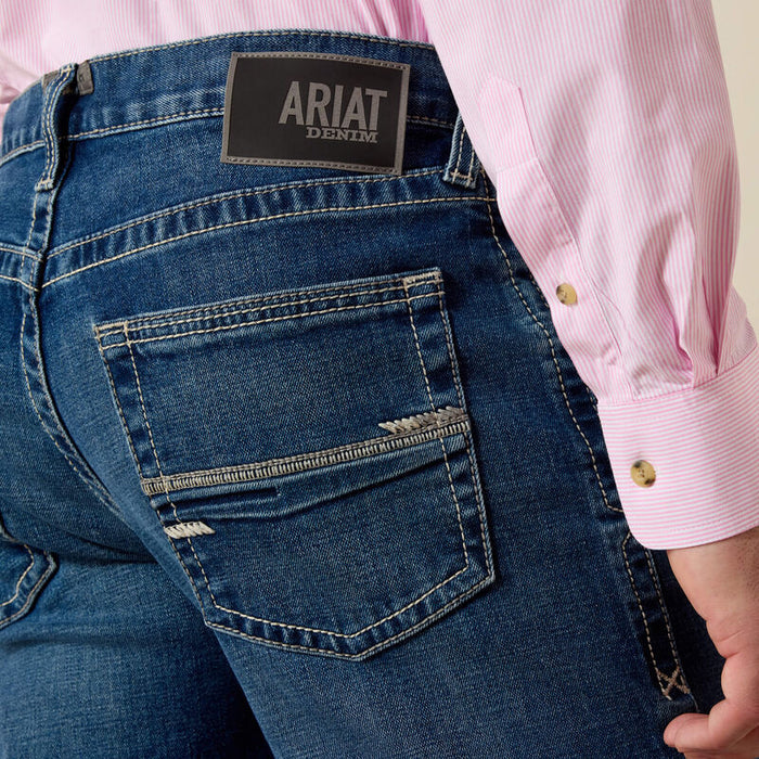 Men's Ariat Mc5 straight leg jeans. Close up of pocket stitching and Ariat logo patch.