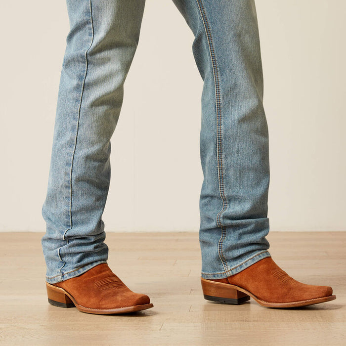 Men's Ariat M7 straight jean in a light wash. Bottom view showing leg opening.