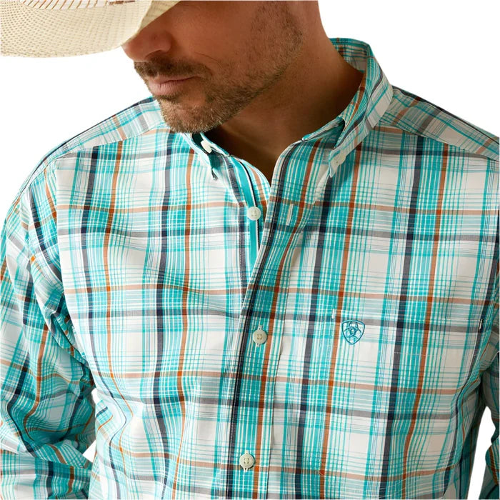 Men's Ariat Pro Series long sleeve shirt in Teal Plaid. Close up of front showing button down collar and Ariat shield logo on left chest pocket.
