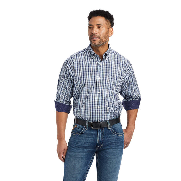 Men's Ariat long sleeve wrinkle free shirt in Airy Blue. Front view showing Blue and White Plaid shirt tucked in with cuffs rolled up to show contrast pattern inside.